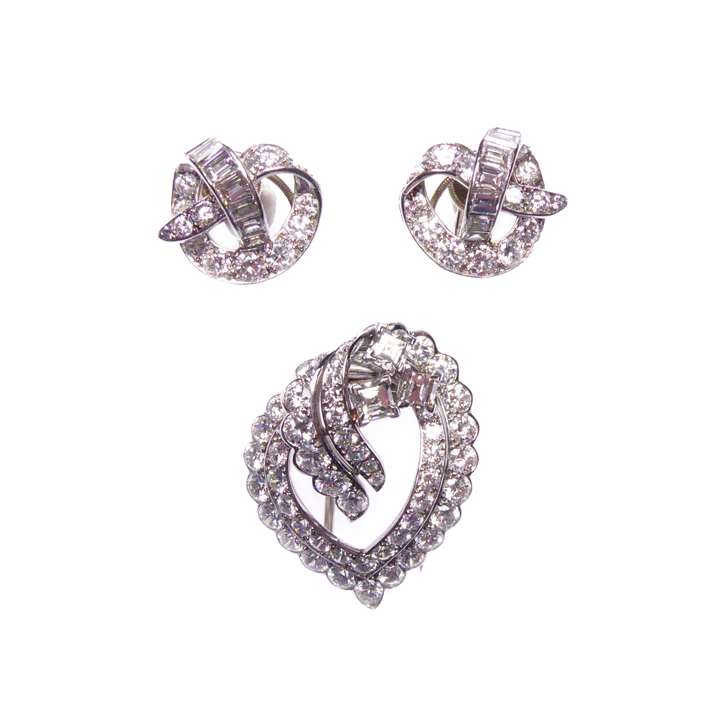 Diamond openwork scroll brooch and earrings en suite
